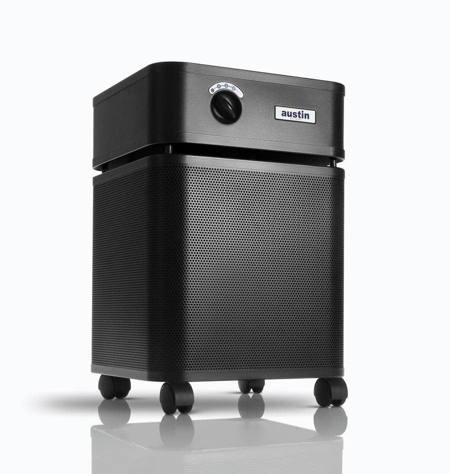 Austin Air HealthMate B400 air purifier in black, showing the perforated steel housing