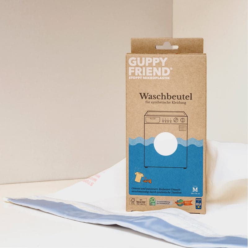 Guppyfriend washing bag with its cardboard packaging box